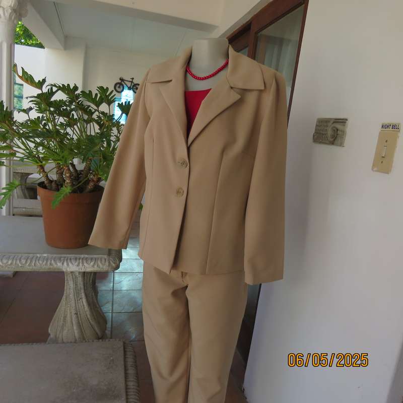 Boutique made rich cream 2pc pantsuit. Long sleeve jacket with 2 button closure. Size 40.