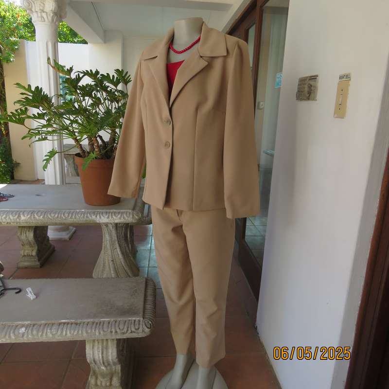 Boutique made rich cream 2pc pantsuit. Long sleeve jacket with 2 button closure. Size 40.