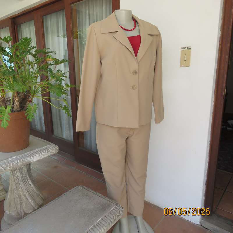 Boutique made rich cream 2pc pantsuit. Long sleeve jacket with 2 button closure. Size 40.