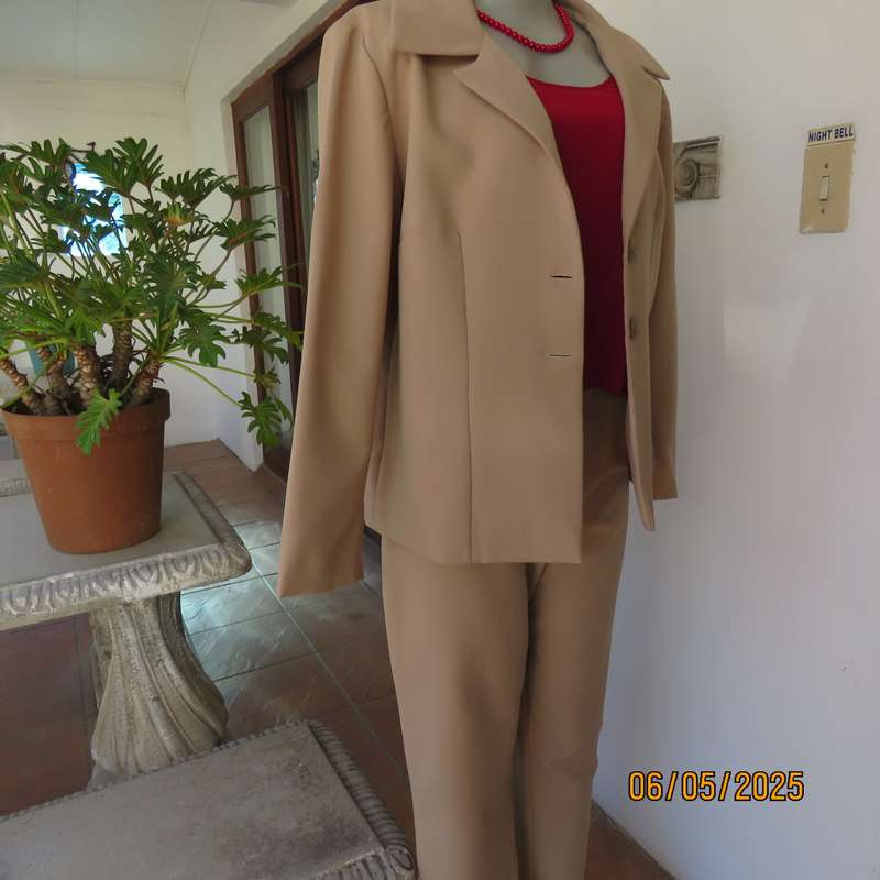 Boutique made rich cream 2pc pantsuit. Long sleeve jacket with 2 button closure. Size 40.