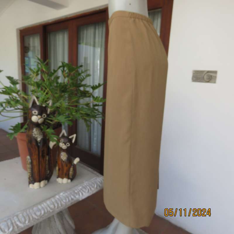 Elegant bronze colour pencil skirt by DONNA CLAIRE size 48. Elasticated back waist sides. As new.