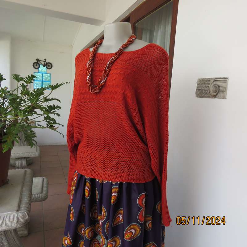 Burnt orange cotton knit long sleeve top. Horizontal cable knit across front and sleeves.Size 36.