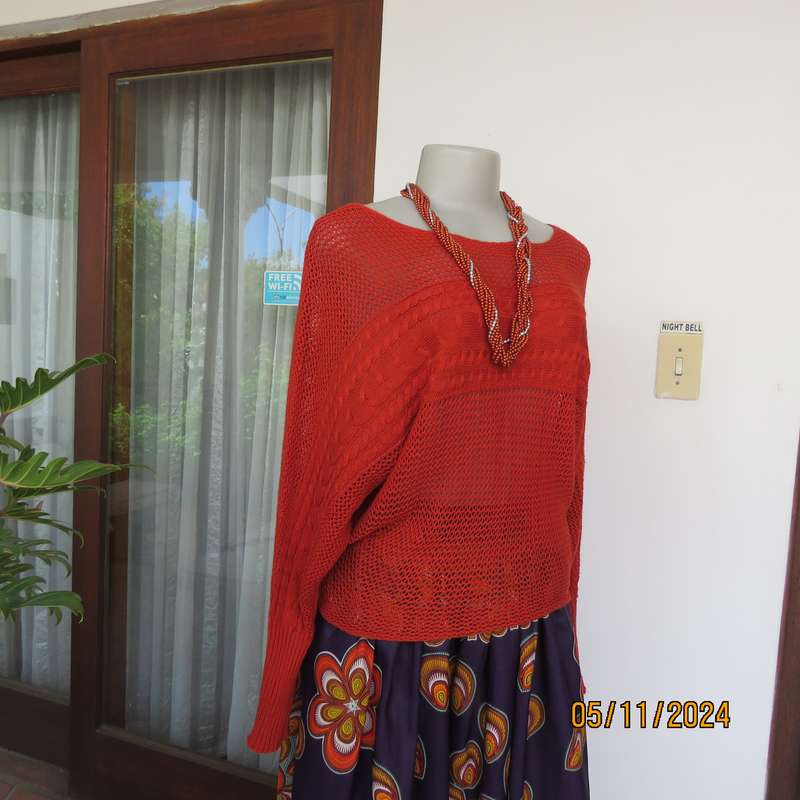 Burnt orange cotton knit long sleeve top. Horizontal cable knit across front and sleeves.Size 36.