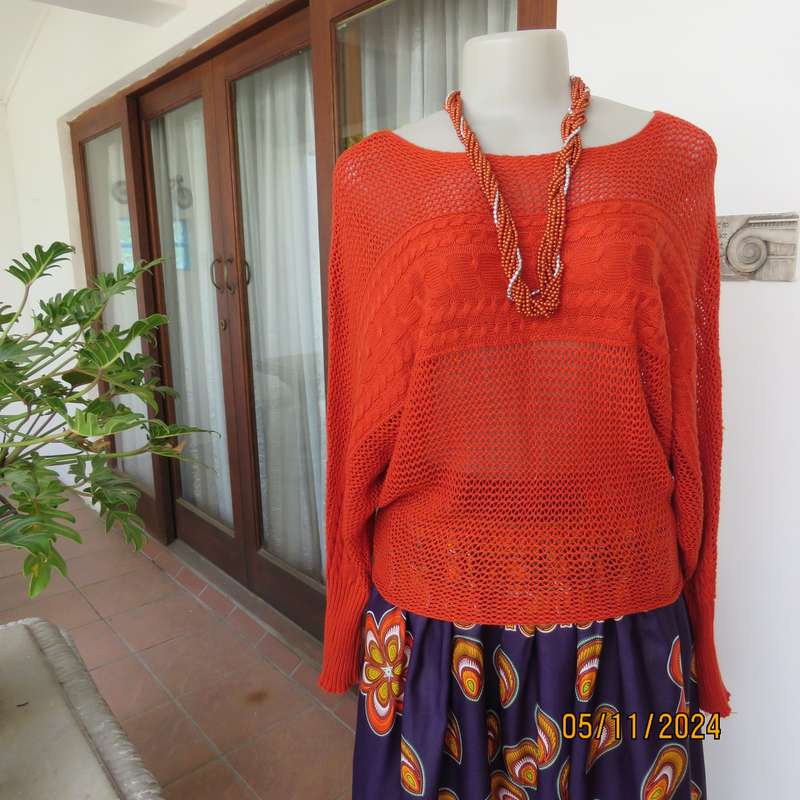 Burnt orange cotton knit long sleeve top. Horizontal cable knit across front and sleeves.Size 36.