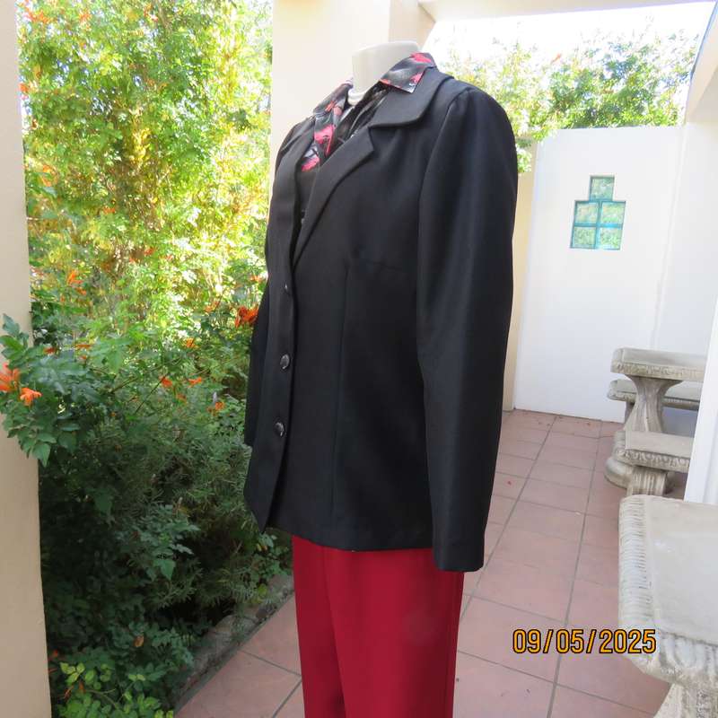 Boutique made black textured polyester long sleeve fully lined size 40 jacket.