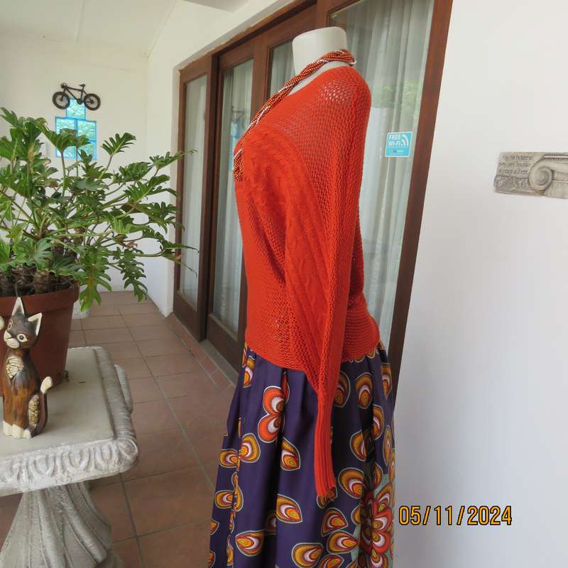 Burnt orange cotton knit long sleeve top. Horizontal cable knit across front and sleeves.Size 36.