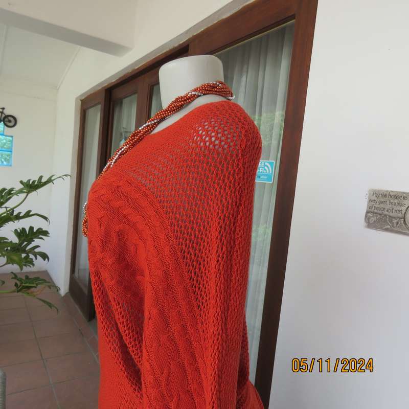 Burnt orange cotton knit long sleeve top. Horizontal cable knit across front and sleeves.Size 36.