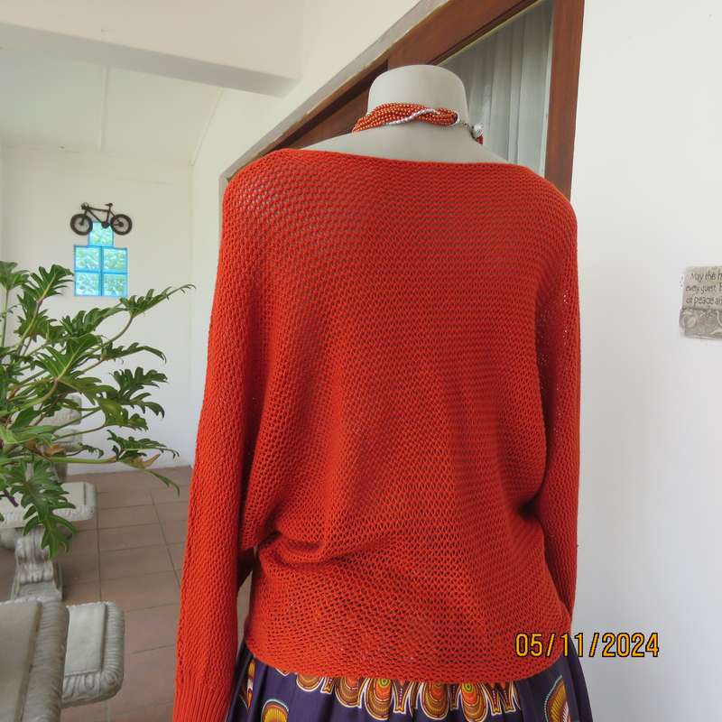 Burnt orange cotton knit long sleeve top. Horizontal cable knit across front and sleeves.Size 36.