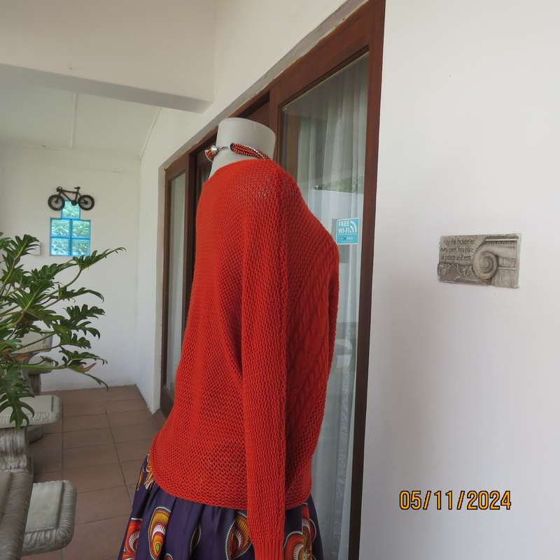 Burnt orange cotton knit long sleeve top. Horizontal cable knit across front and sleeves.Size 36.