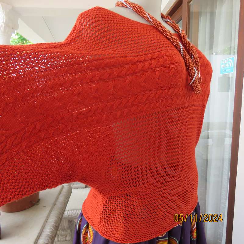 Burnt orange cotton knit long sleeve top. Horizontal cable knit across front and sleeves.Size 36.