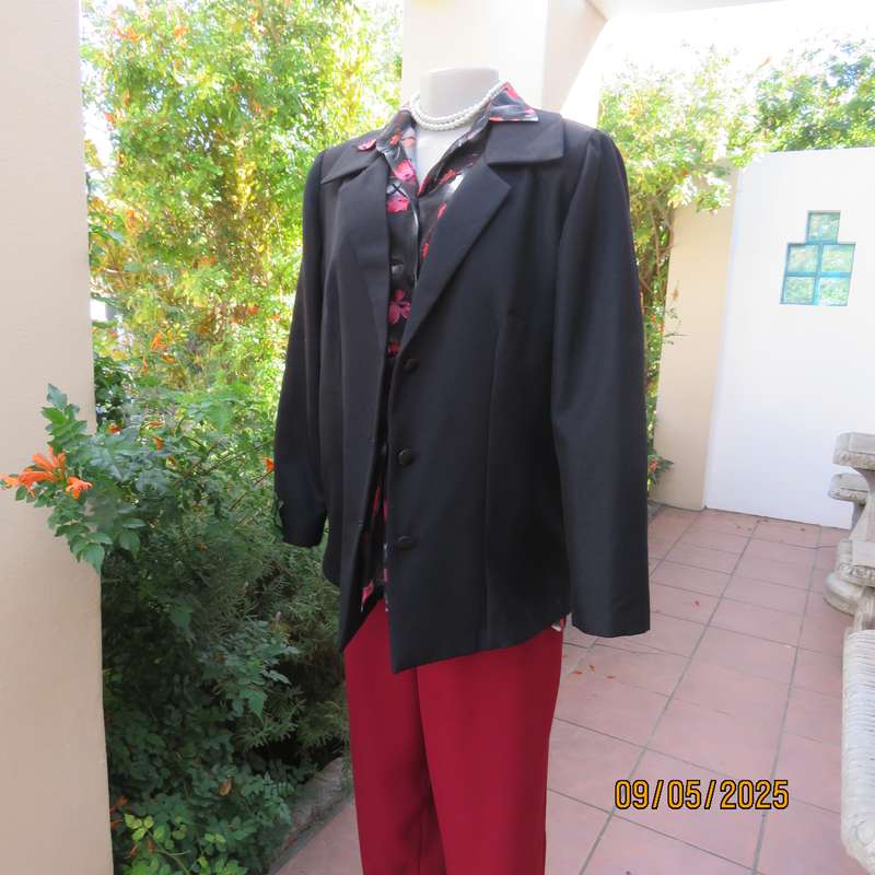 Boutique made black textured polyester long sleeve fully lined size 40 jacket.