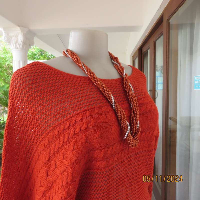Burnt orange cotton knit long sleeve top. Horizontal cable knit across front and sleeves.Size 36.