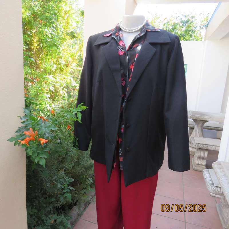 Boutique made black textured polyester long sleeve fully lined size 40 jacket.