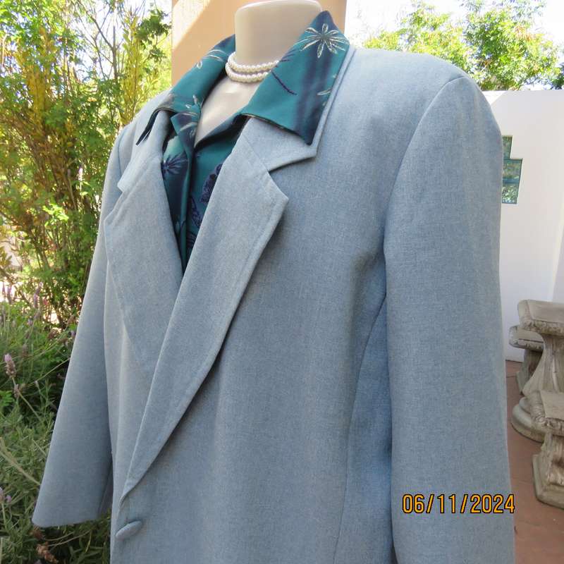Boutique made light blue polyester-wool blend long sleeve jacket. Open collar.One button.Size 50-52