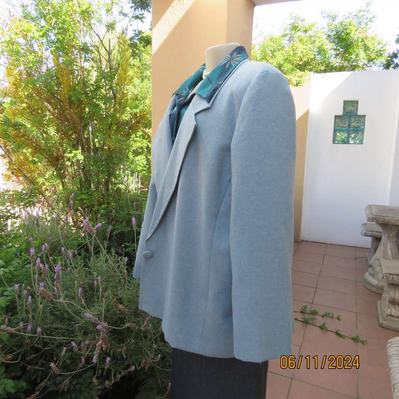 Boutique made light blue polyester-wool blend long sleeve jacket. Open collar.One button.Size 50-52