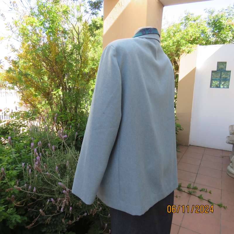 Boutique made light blue polyester-wool blend long sleeve jacket. Open collar.One button.Size 50-52