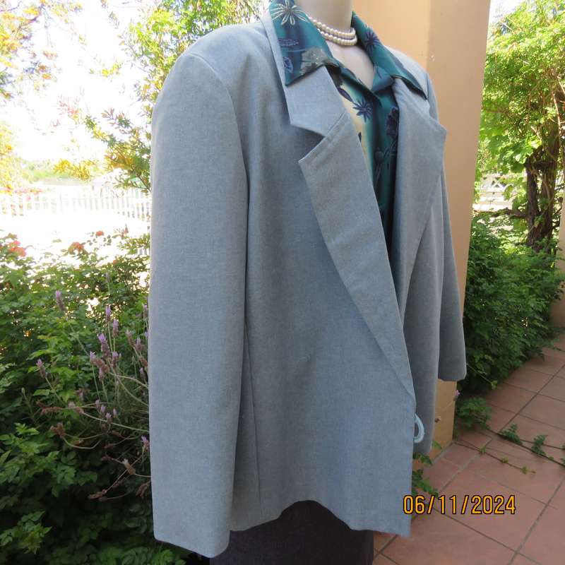 Boutique made light blue polyester-wool blend long sleeve jacket. Open collar.One button.Size 50-52
