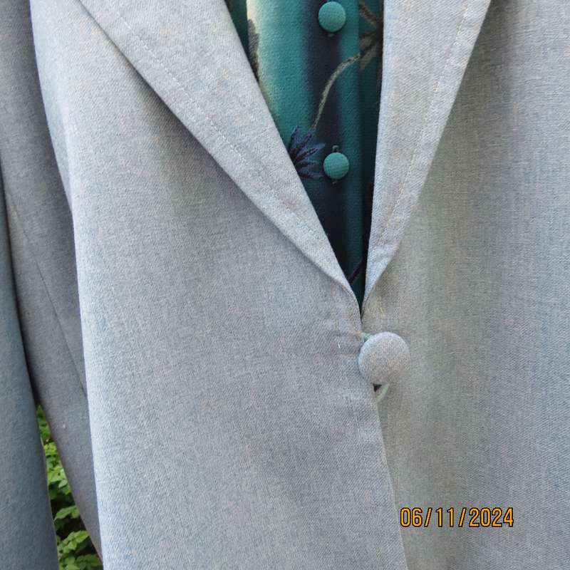 Boutique made light blue polyester-wool blend long sleeve jacket. Open collar.One button.Size 50-52