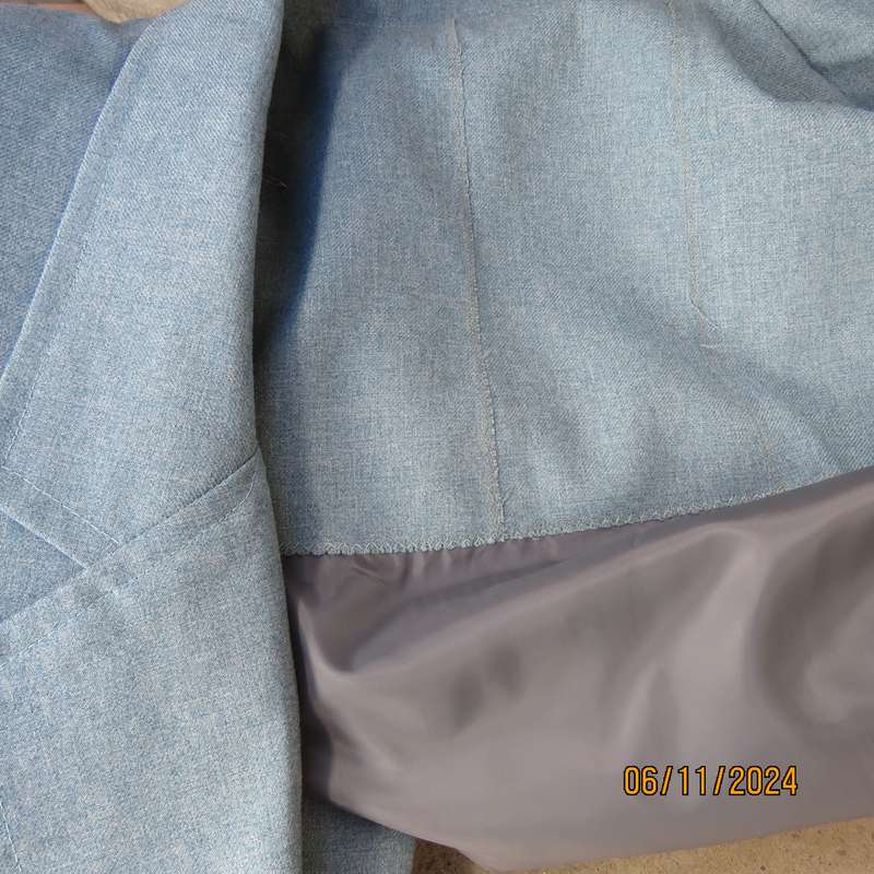 Boutique made light blue polyester-wool blend long sleeve jacket. Open collar.One button.Size 50-52