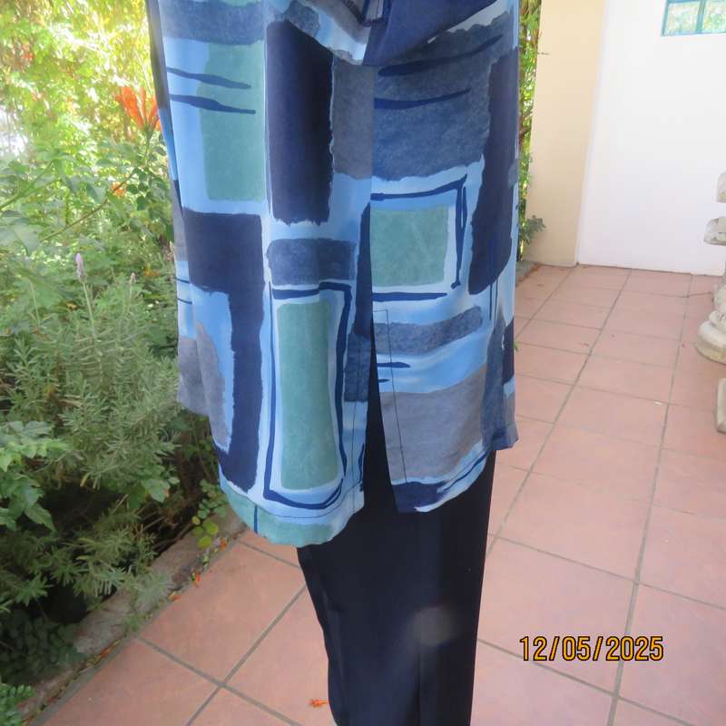 Short sleeve button down top in medley of blues. Geometric print in polyester. Size 44.