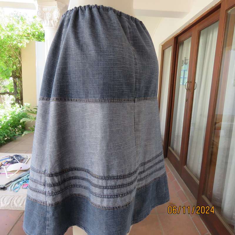 Blue denim skirt in horizontal panels with cord decoration Size 38-40.Polycotton. Elasticated waist.