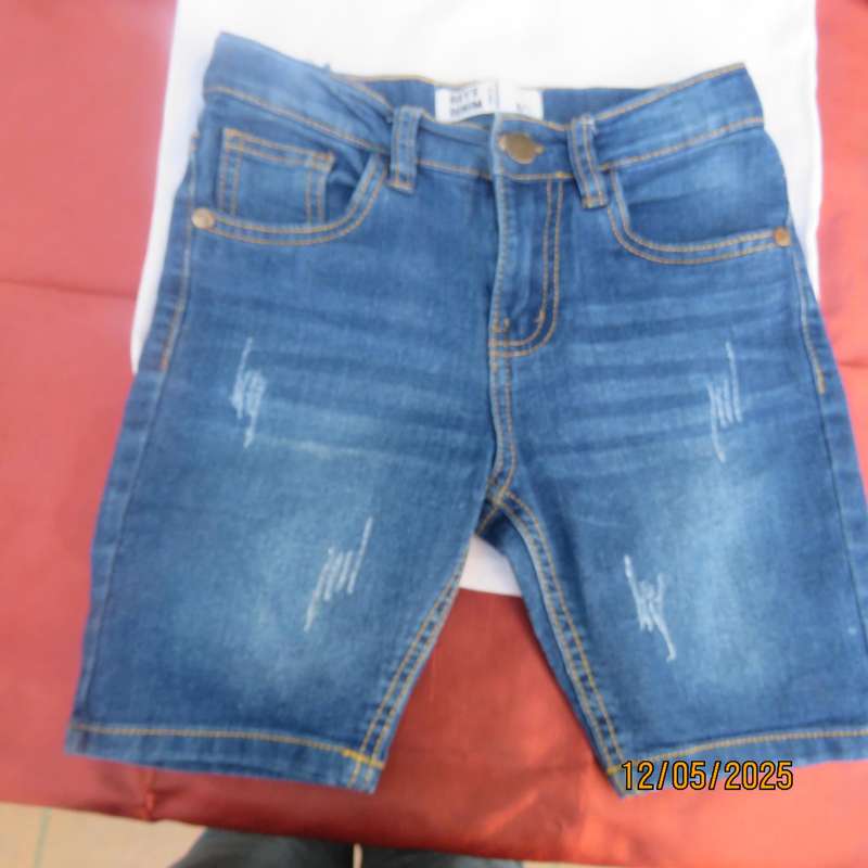 Set of blue denim jean shorts and white golf shirt for 6 to 7 year old boy.
