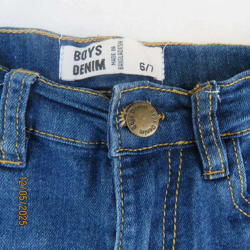 Set of blue denim jean shorts and white golf shirt for 6 to 7 year old boy.