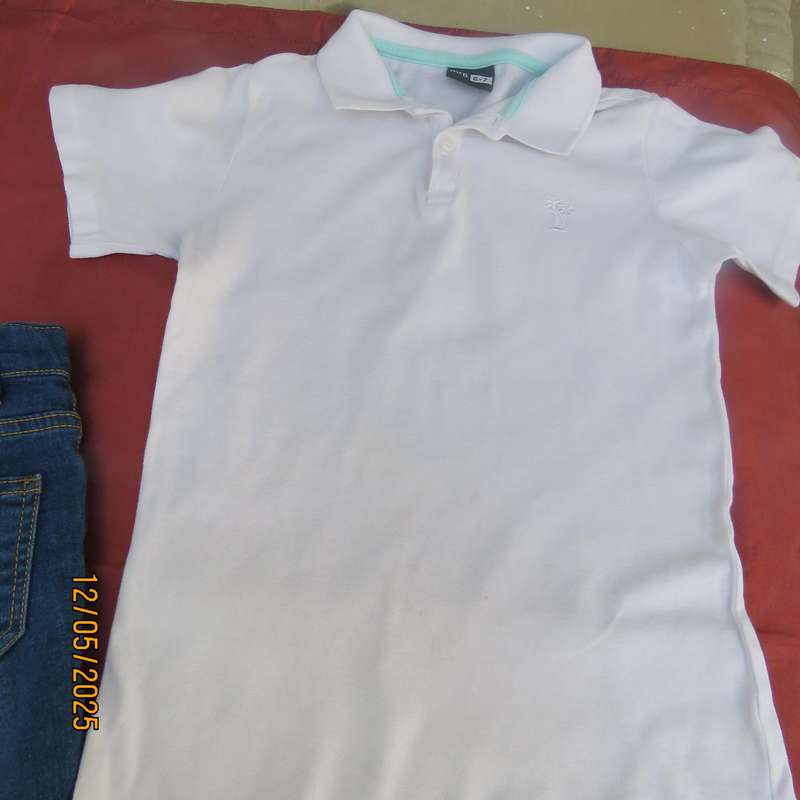Set of blue denim jean shorts and white golf shirt for 6 to 7 year old boy.