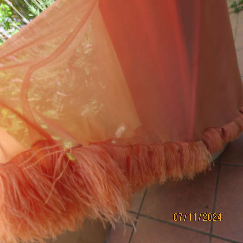 Glamorous half flare peach long skirt-underlay idark crimson satin. Size 36-38.Ostrich feather seam
