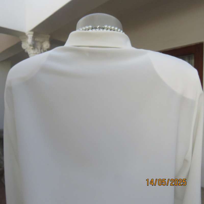 WOOLWORTHS elegant light cream textured polyester top with tucked seams. Size 36.