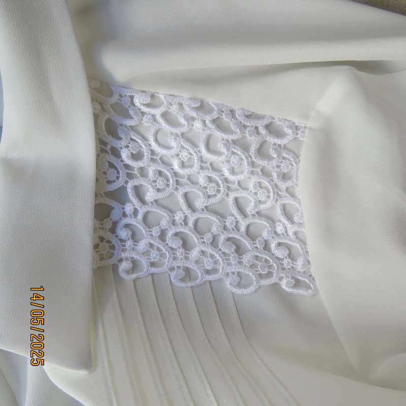 WOOLWORTHS elegant light cream textured polyester top with tucked seams. Size 36.