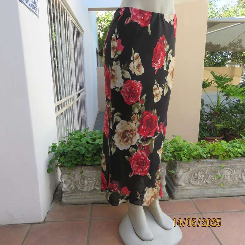 MASSUMI black ankle length fully lined skirt with bold red and cream flowers. Size 38