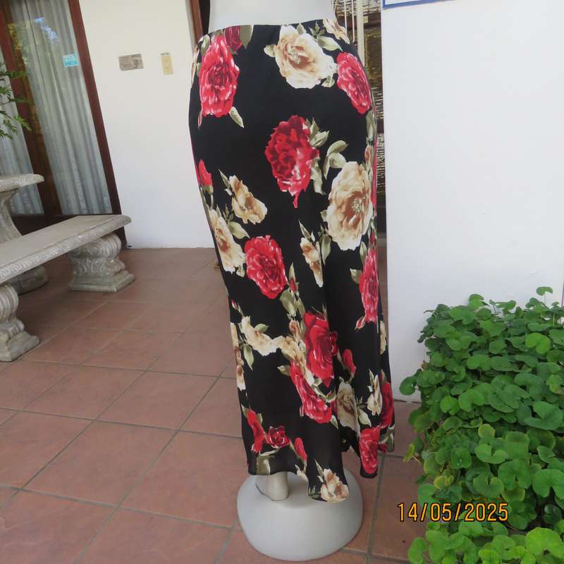 MASSUMI black ankle length fully lined skirt with bold red and cream flowers. Size 38