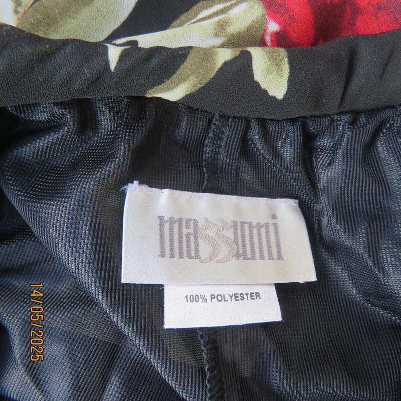 MASSUMI black ankle length fully lined skirt with bold red and cream flowers. Size 38