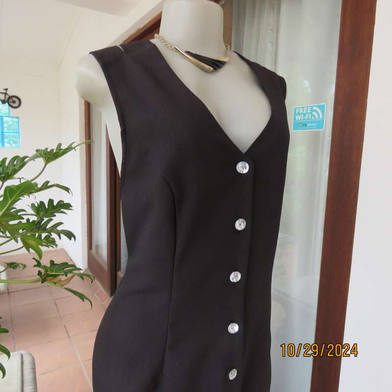 Beautiful black sleek button down ankle length dress by CHARLOTTE size 36. Criss cross strap back.