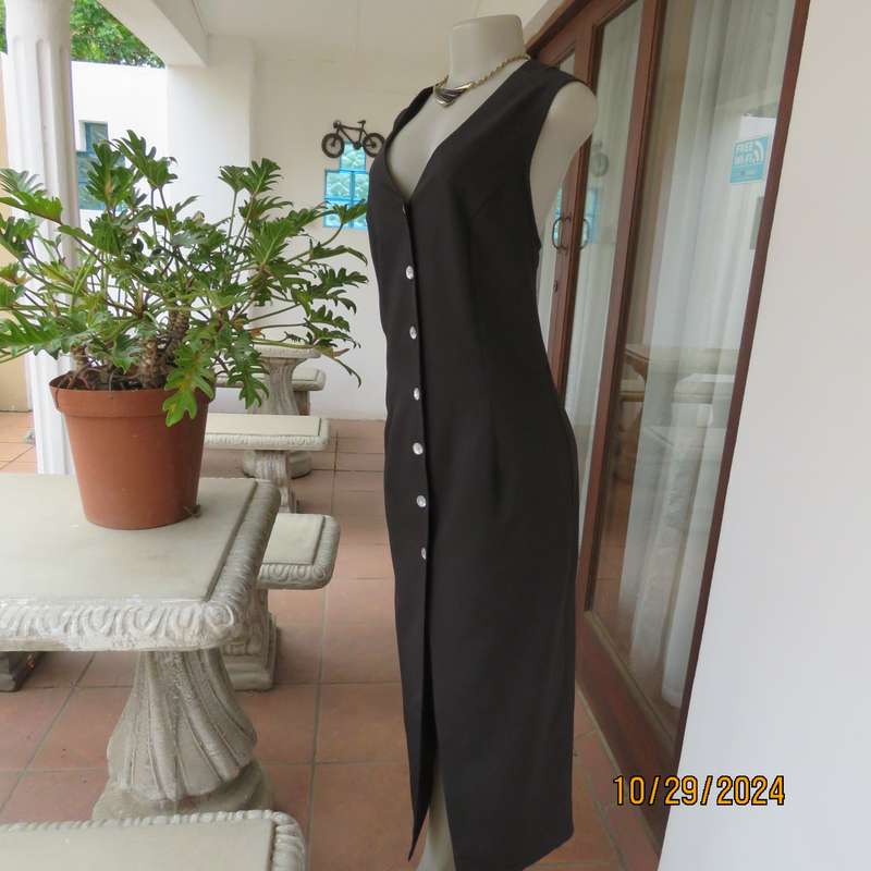 Beautiful black sleek button down ankle length dress by CHARLOTTE size 36. Criss cross strap back.