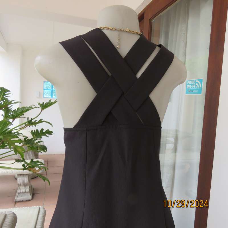 Beautiful black sleek button down ankle length dress by CHARLOTTE size 36. Criss cross strap back.