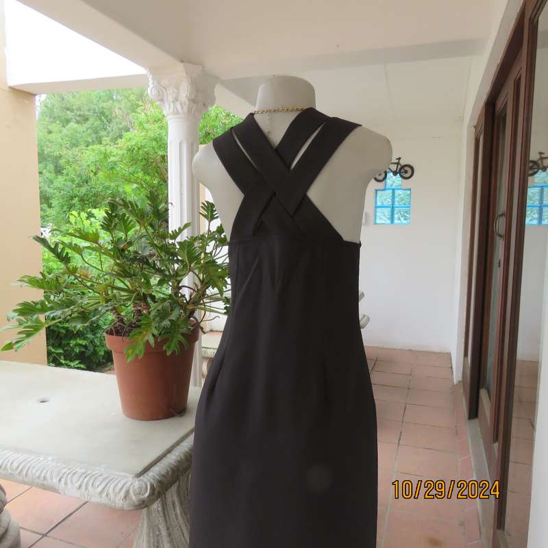 Beautiful black sleek button down ankle length dress by CHARLOTTE size 36. Criss cross strap back.