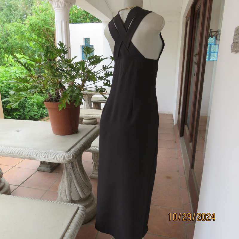 Beautiful black sleek button down ankle length dress by CHARLOTTE size 36. Criss cross strap back.