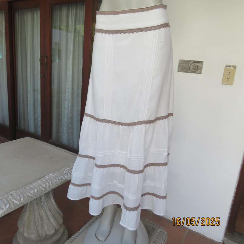 Ankle length light cream polycotton tiered bandless skirt. Tucking and lace decoration. Size 34