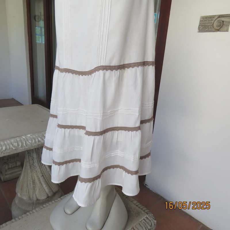 Ankle length light cream polycotton tiered bandless skirt. Tucking and lace decoration. Size 34