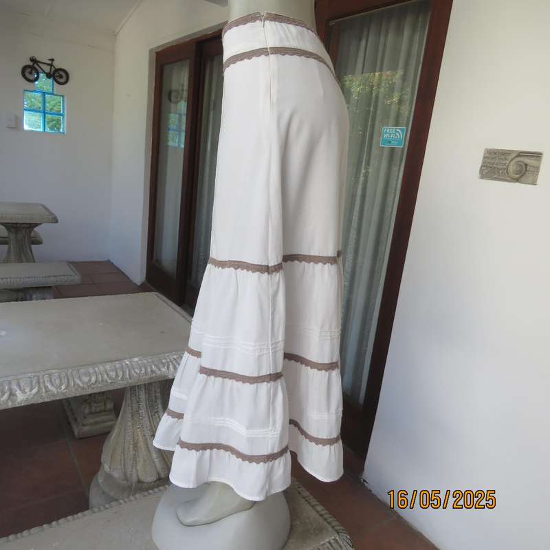 Ankle length light cream polycotton tiered bandless skirt. Tucking and lace decoration. Size 34
