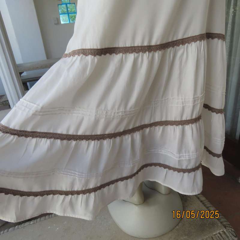 Ankle length light cream polycotton tiered bandless skirt. Tucking and lace decoration. Size 34