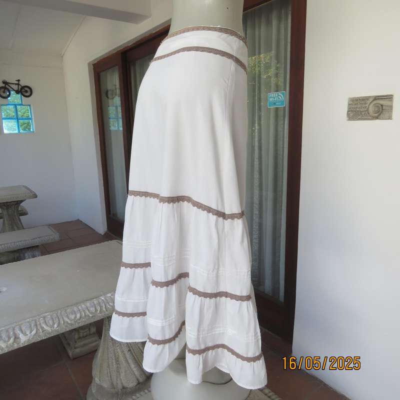 Ankle length light cream polycotton tiered bandless skirt. Tucking and lace decoration. Size 34
