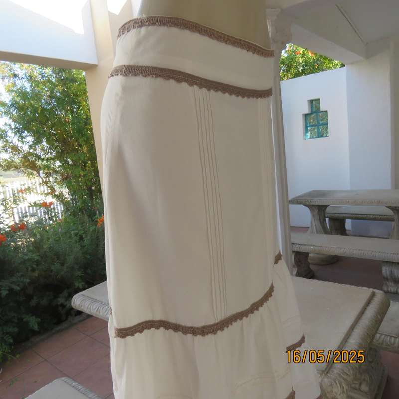 Ankle length light cream polycotton tiered bandless skirt. Tucking and lace decoration. Size 34