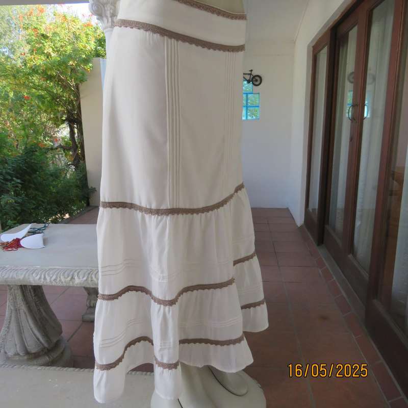 Ankle length light cream polycotton tiered bandless skirt. Tucking and lace decoration. Size 34