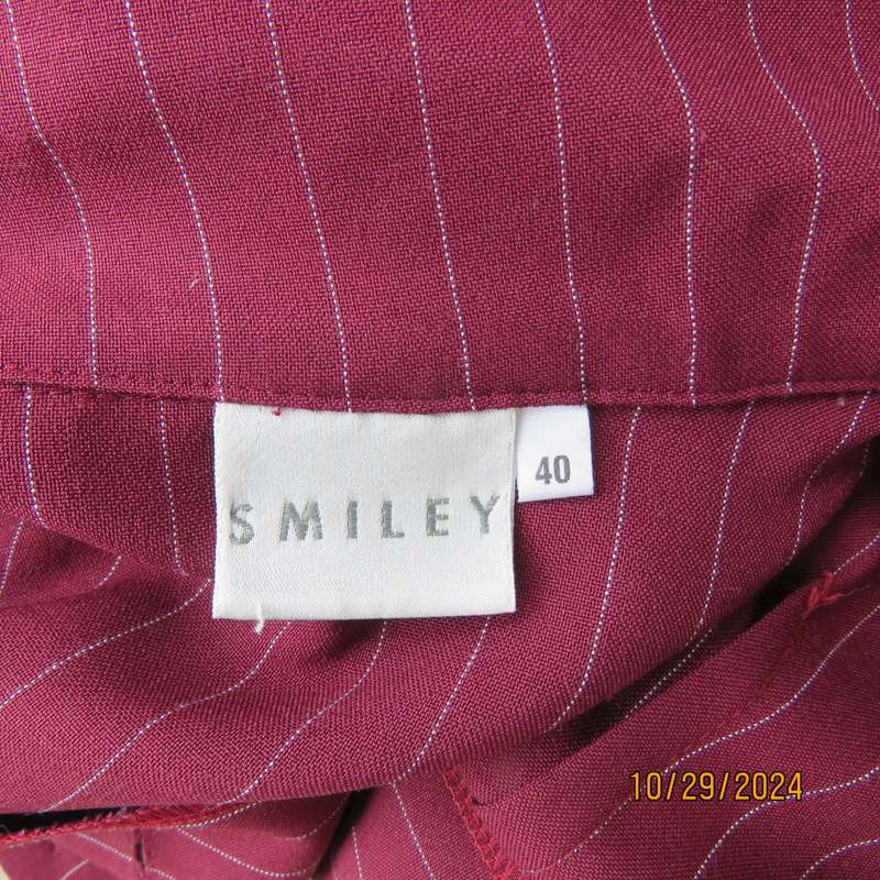 Classic maroon-white pinstripe 2 pc pantsuit. In 100% polyester. Tailored 1 button jacket. Size 40.