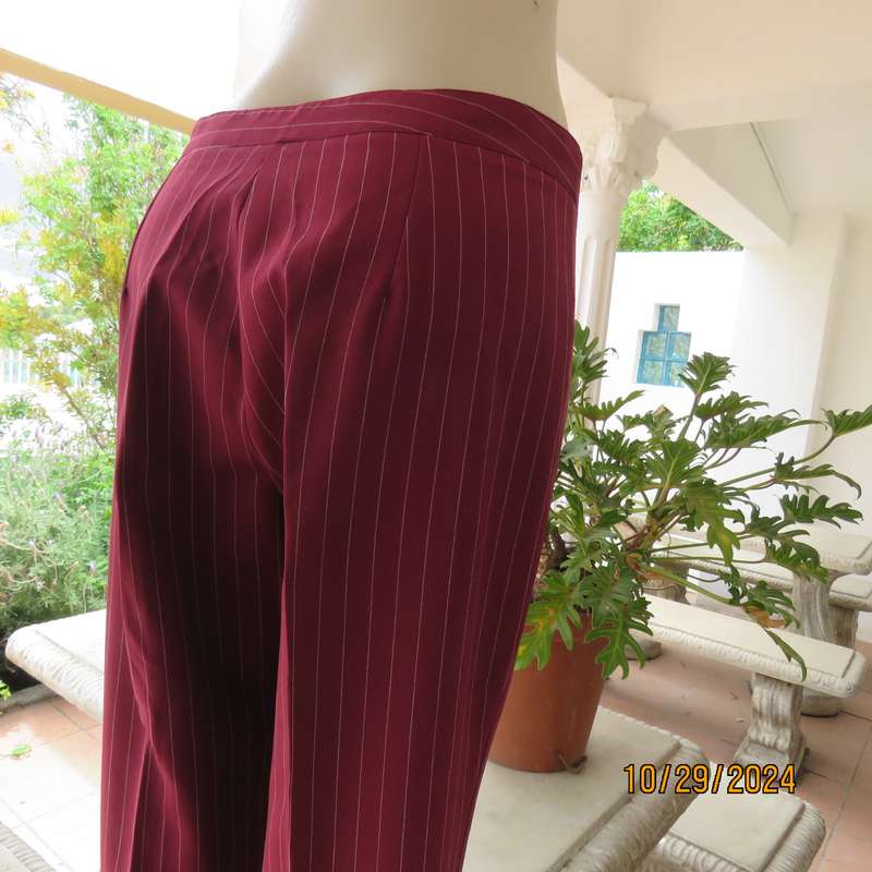 Classic maroon-white pinstripe 2 pc pantsuit. In 100% polyester. Tailored 1 button jacket. Size 40.