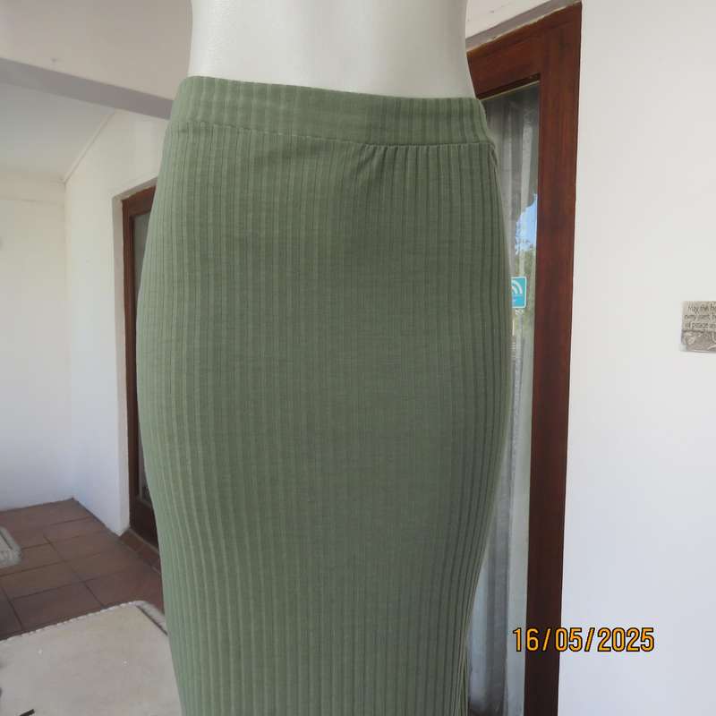 IQ olive green ribbed polyester bodycon low calf length skirt. Size 34