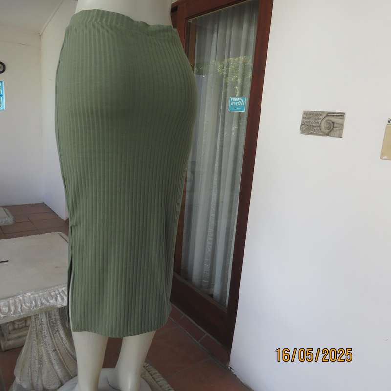 IQ olive green ribbed polyester bodycon low calf length skirt. Size 34
